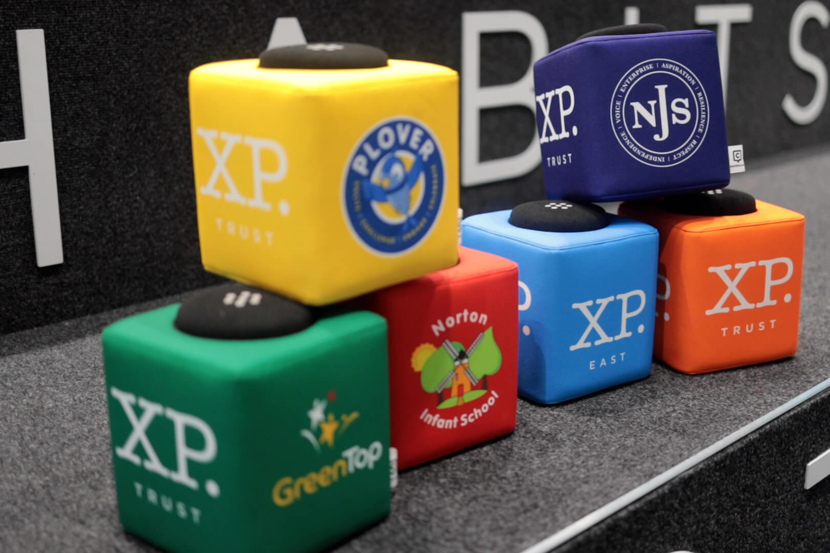 Colorful Catchbox microphones for hybrid classroom engagement