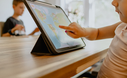 Children using interactive classroom technology to connect