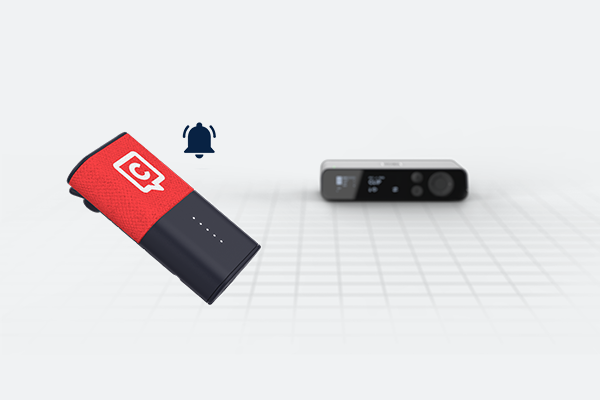 An illustration featuring the Catchbox Clip wearable microphone, a bell icon, and the Catchbox DSP Hub in the background, representing an out-of-range alarm.