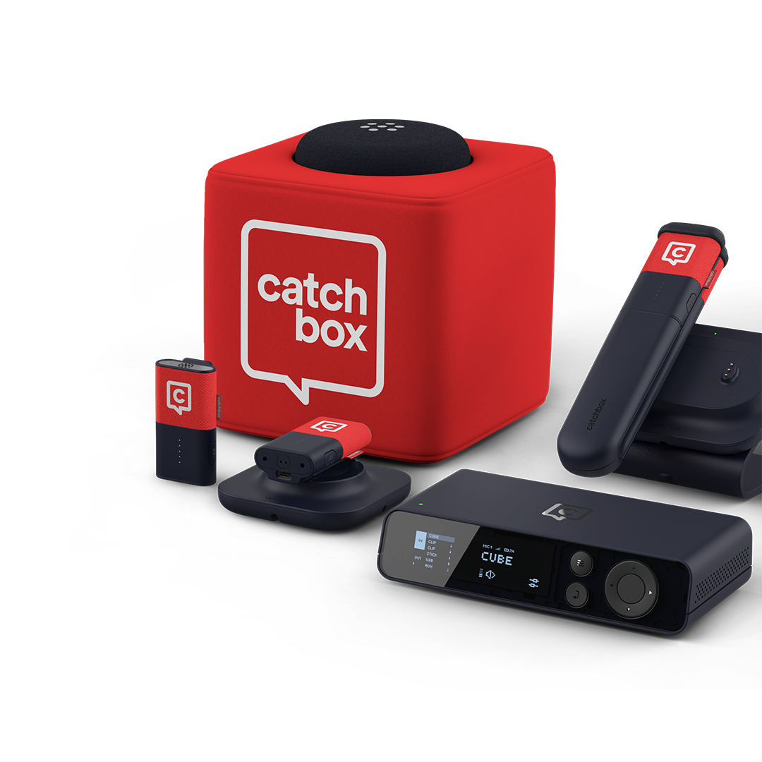 Catchbox Plus system with Hub DSP receiver, Stick handheld, Clip wearable mics placed on Charging Dock, Cube throwable mic on Charging Base.