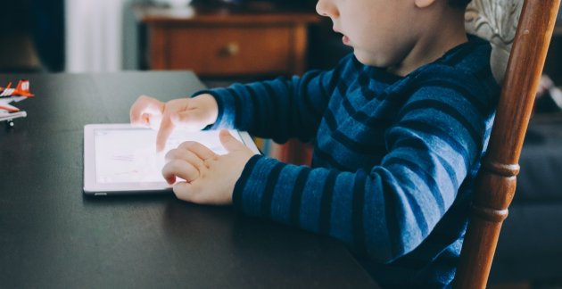 A child using tablet to learn