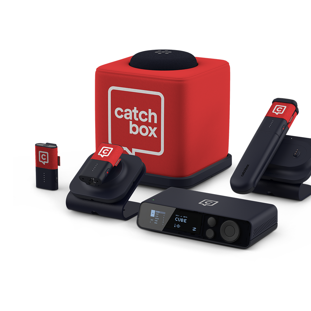 Catchbox Plus system with Hub DSP receiver, Stick handheld, Clip wearable mics placed on Charging Dock, Cube throwable mic on Charging Base.