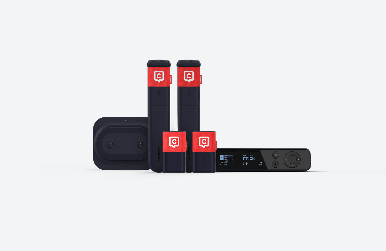 Catchbox presenter bundle in red, featuring two Clip microphones and two Stic microphones. Dual Charging Dock and Hub DSP receiver are positioned on the sides.